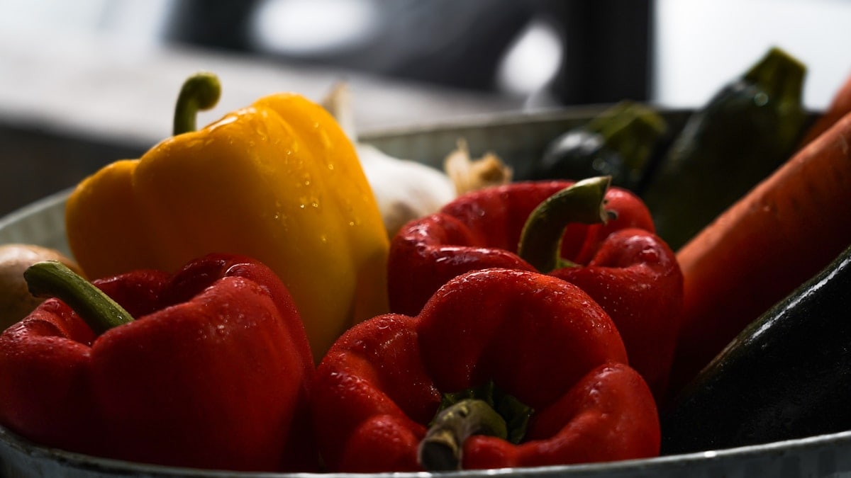 basin of variety colored bell peppers